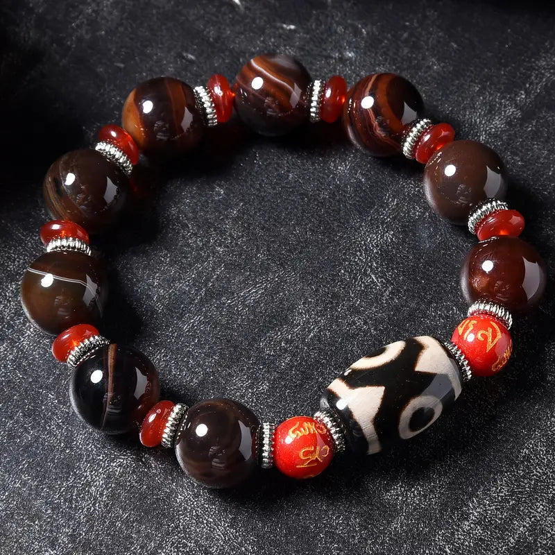 Brown striped with three eye beads unisex Tibetan bracelet
